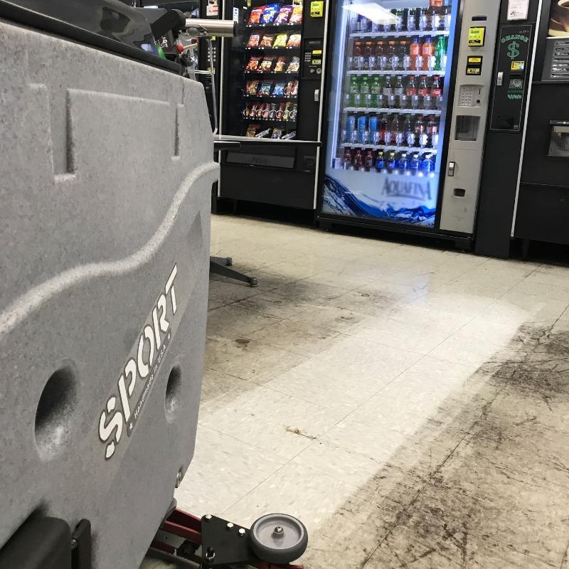 Tomcat Walk Behind Floor Scrubbers Sport lunchrooms vct SPORT Walk Behind Floor Scrubber cleaning the VCT floor in a lunch room of a tech school in Nashville, Tennessee