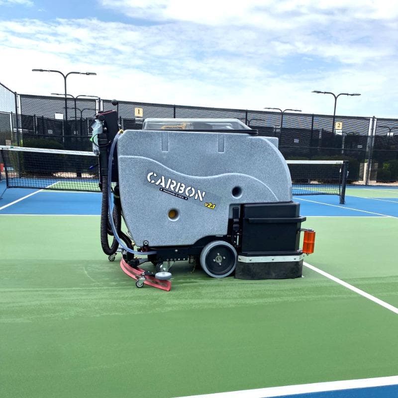 Tomcat Walk Behind Floor Scrubbers Carbon tennis court concrete CARBON Walk Behind Floor Scrubber cleaning the tennis courts at a Dayton, Ohio health club.
