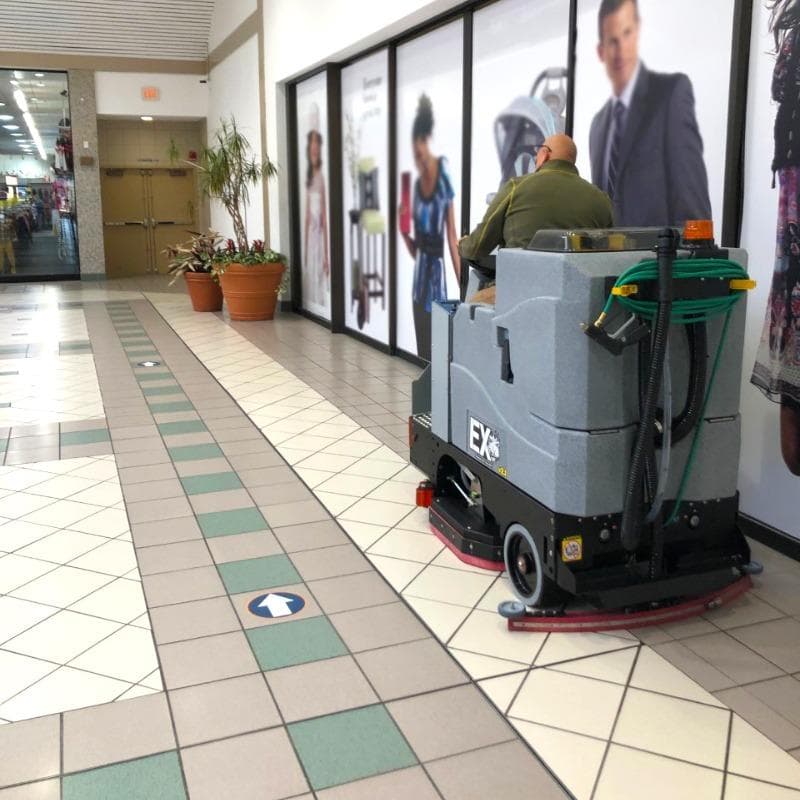 Tomcat Ride On Floor Scrubbers EX atrium ceramic tile A Tomcat EX ride on battery floor scrubber cleaning ceramic tile floors in an atrium of a shopping mall in Rockaway, NJ