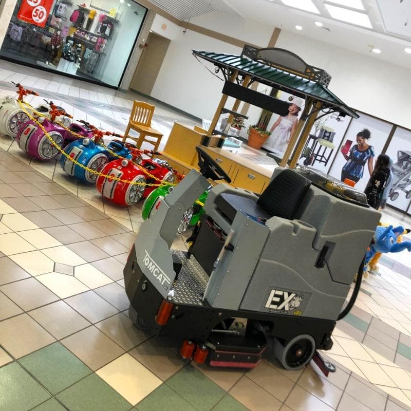 Tomcat Ride On Floor Scrubbers EX atrium ceramic tile A Tomcat EX ride on battery floor scrubber cleaning ceramic tile floors in an atrium of a shopping mall in Rockaway, NJ