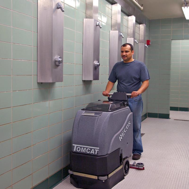 Tomcat Walk Behind Floor Scrubbers Recon shower ceramic tile RECON Walk Behind Floor Scrubber cleaning the ceramic tile floors in the locker room shower of a Kansas City, Kansas middle school gym